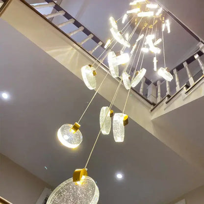 Modern gold crystal led stair slinglight pendant light with cascading circular glass orbs and gold-toned decorbites crystal led fixtures