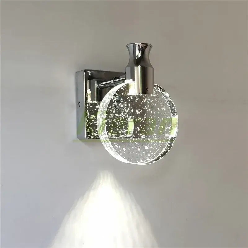 Modern gold crystal led wall lamp with chrome finish and clear glass globe featuring embedded white speckles decorbites crystal led
