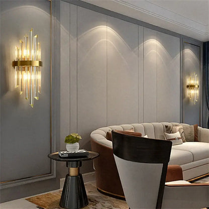 Modern gold crystal led wall lamp bedroom sconce with vertical crystal rods and circular brass base from decorbites crystal led