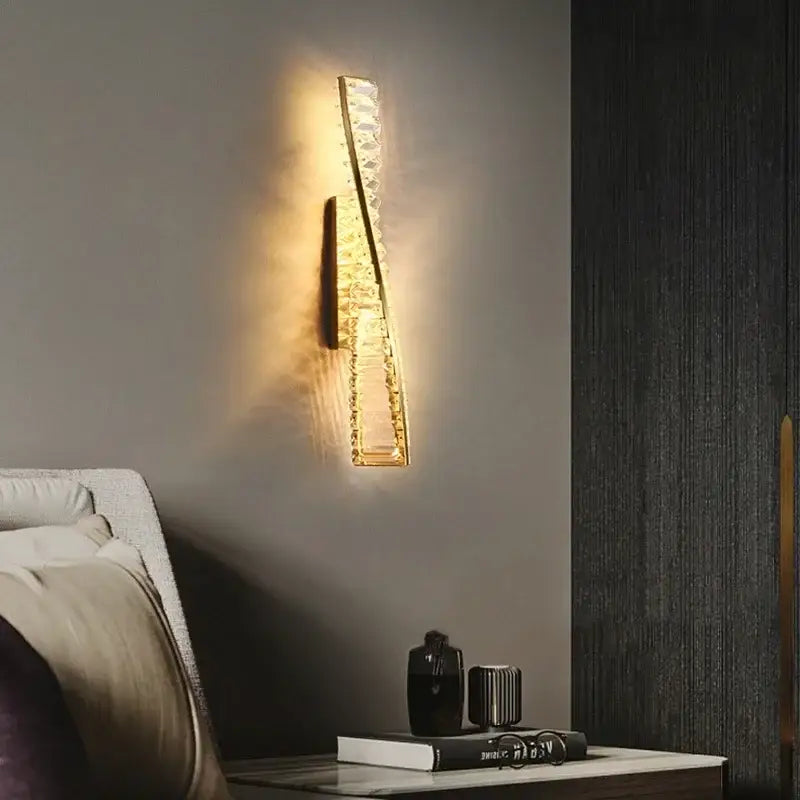 A sleek modern gold crystal led wall lamp with embedded crystals emitting warm glow for luxury bedroom decorbites lighting