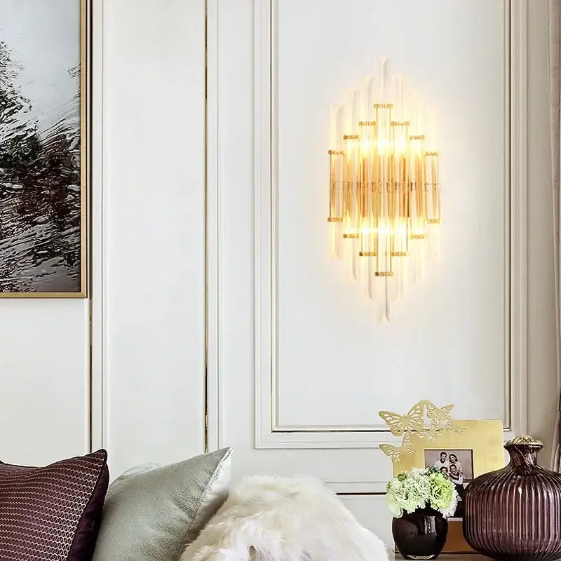 Modern gold crystal led wall sconce with glass rods and warm lighting for bedroom use featuring vertical crystals
