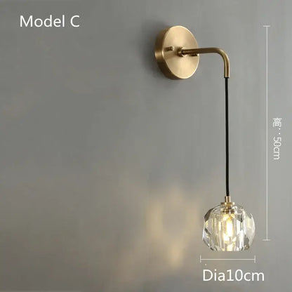 Modern gold crystal led wall sconce with brass finish curved arm and faceted globe for luxury decorbites crystal led decor