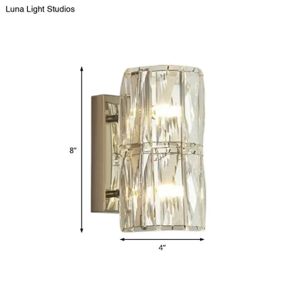 Clear crystal glass linear wall light with brushed nickel finish and vertical faceted design for dining room use