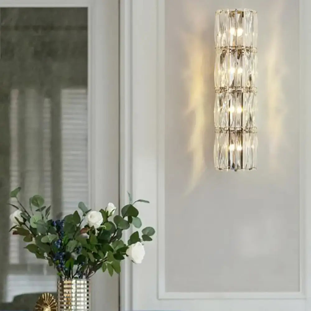 Modern gold crystal linear wall light dining room sconce with stacked clear faceted crystals and polished metal frames