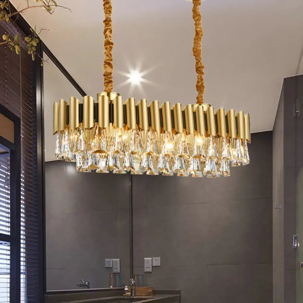 DecorBites gold crystal chandelier with cylindrical brass arms and crystal droplets for elegant oval dining room lighting