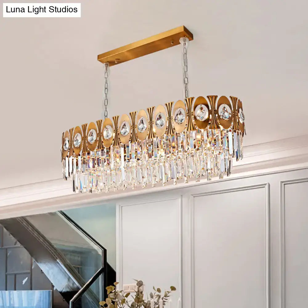 Modern gold crystal oval suspension island pendant light with gold-toned rectangular frame and crystal droplets
