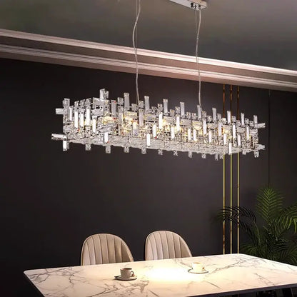 Modern gold crystal pendant chandelier with sleek geometric design of clear prisms illuminated by warm lights decorbites crystal pendant