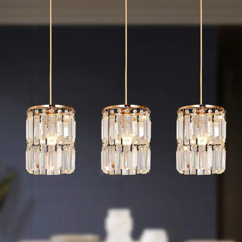 Three elegant gold-toned crystal pendant lights with metal frames and rods modern pendant light for dining room
