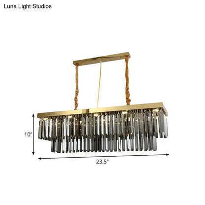 Decorbites modern gold pendant light with rectangular frame and cascading clear crystal prisms suspended by twisted ropes