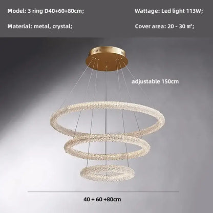 Modern gold crystal pendant lights featuring a gold-toned three-ring chandelier with crystal pendant lights decorbites design