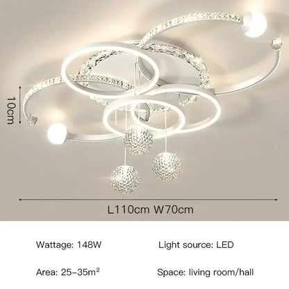 Modern white and crystal dimmable led pendant light with interlocking rings and dangling spherical ornaments for dining room