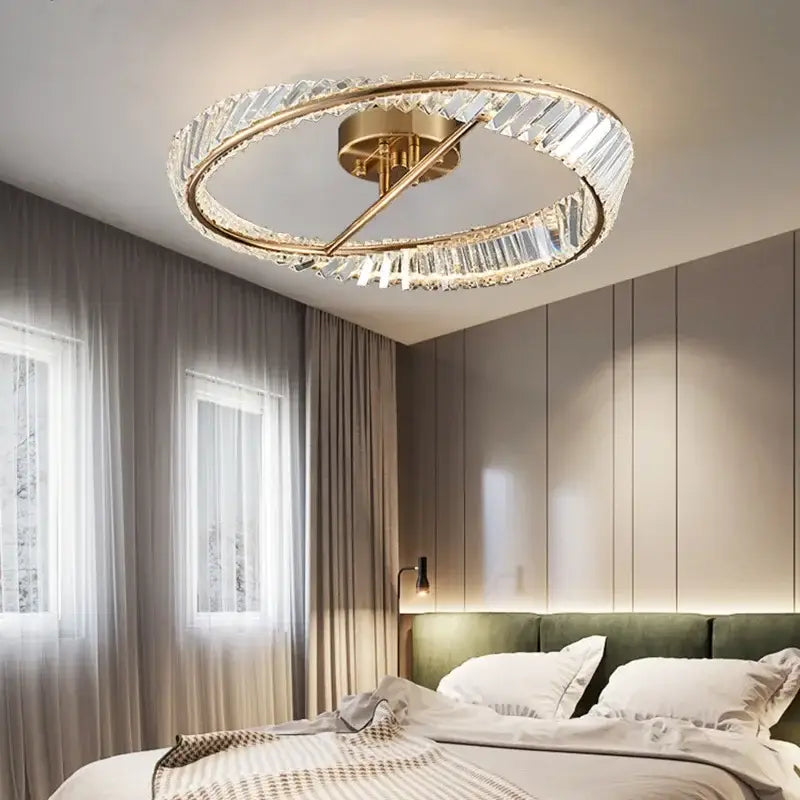 Modern gold ceiling light with decorbites crystal rings and central brass fixture for living room decor