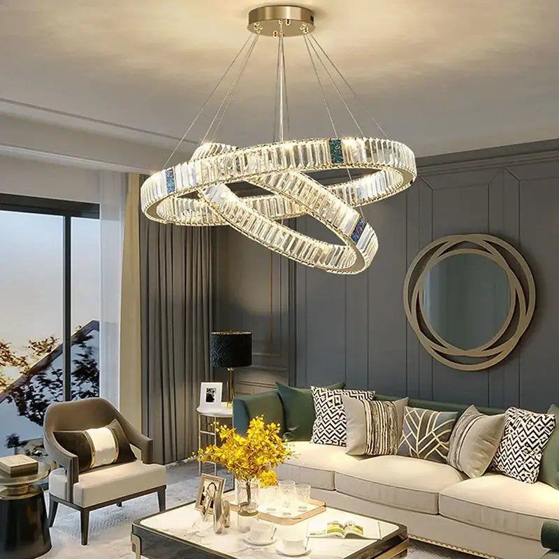 Modern gold crystal round ceiling chandelier with clear crystal segments and blue accents for dining room decorbites crystal round