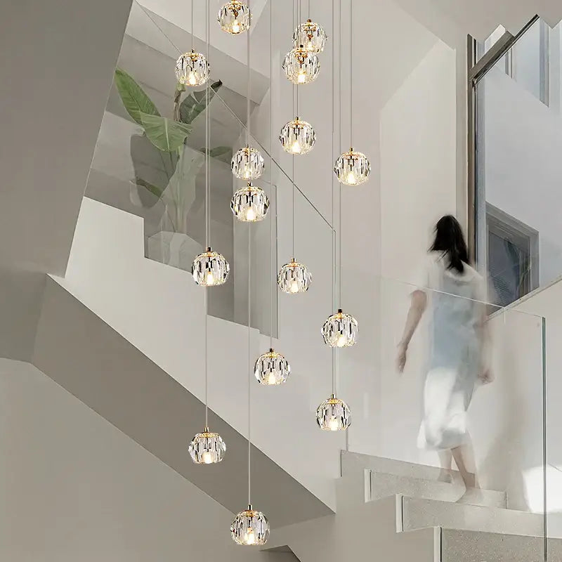 Modern gold crystal stair football shaped chandelier with spherical glass globes and gold metal frames for stairwell decorbites crystal stair