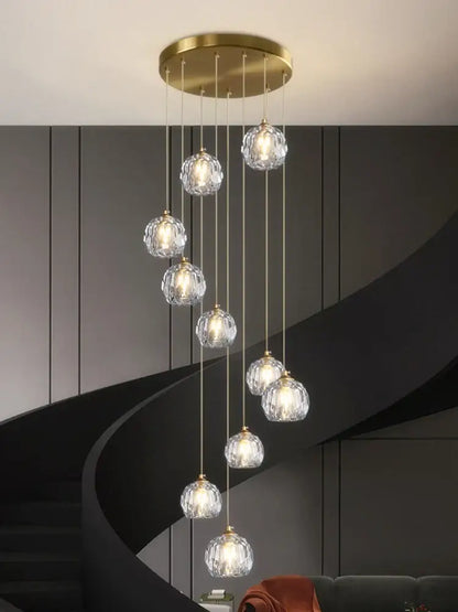 Modern gold crystal stair football shaped chandelier with circular mount and dangling crystal globe pendants for stairwell decorbites crystal stair