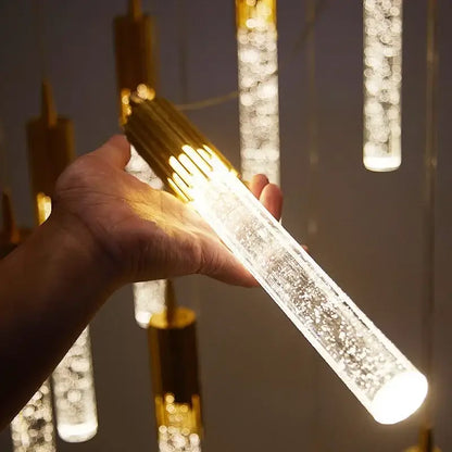 Modern gold crystal staircase chandelier with cylindrical clear acrylic body and sparkling beads by decorbites crystal stairwell lamp