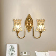 Modern gold crystal swirl wall sconce with two bell-shaped shades and ornate central fixture for bedroom lighting
