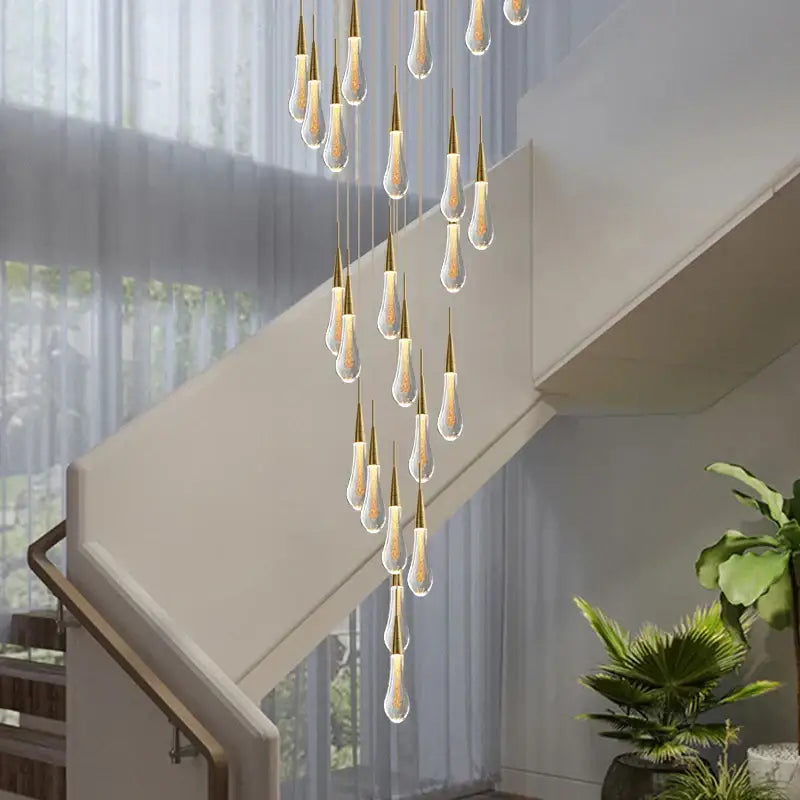 Modern gold crystal teardrop chandelier with illuminated glass pendants for staircase and living room decorbites crystal teardrop