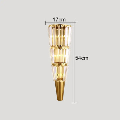 Modern gold crystal torch wall lamp with tiered faceted glass panels and conical base for elegant living room decorbites crystal torch