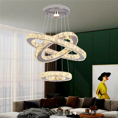 Modern gold decorbites crystal triangle chandelier with interlocking rings chrome finish and clear faceted crystals for living room