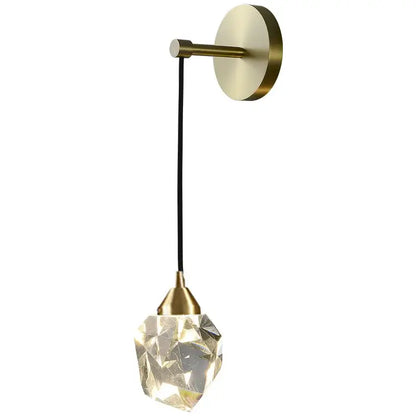 Modern gold crystal wall lamp with brass base and faceted glass pendant glowing warmly for bedroom decorbites crystal wall