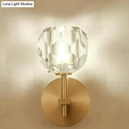 DecorBites™ ivy crystal wall lamp featuring a clear faceted crystal globe with a brushed brass base and stem