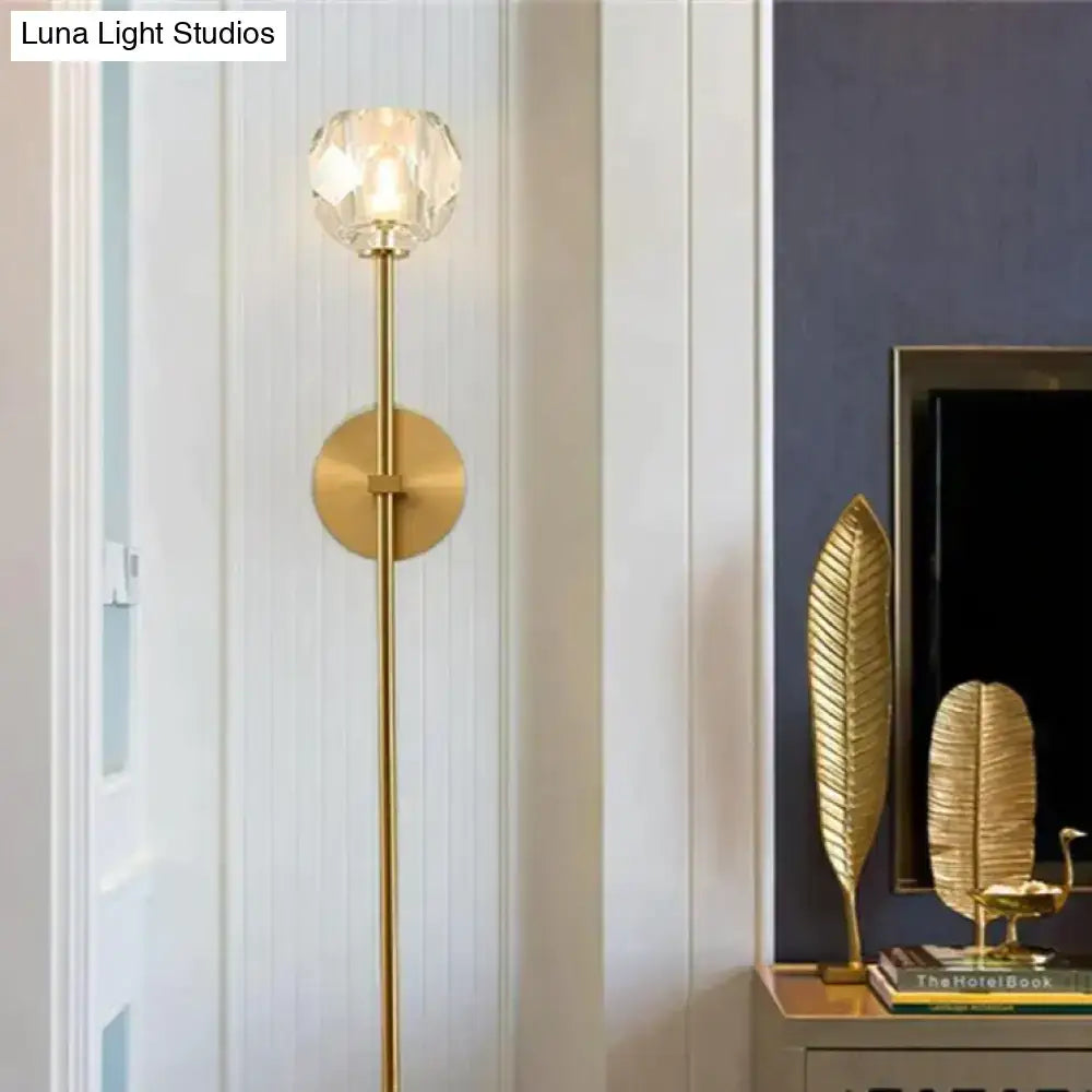 Decorbites™ ivy crystal wall lamp with a tall slender brass frame and faceted crystal globe shade in warm gold tones