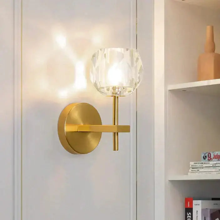 Gold-toned decorbites ivy wall lamp featuring a faceted crystal glass shade as a stylish crystal wall lamp