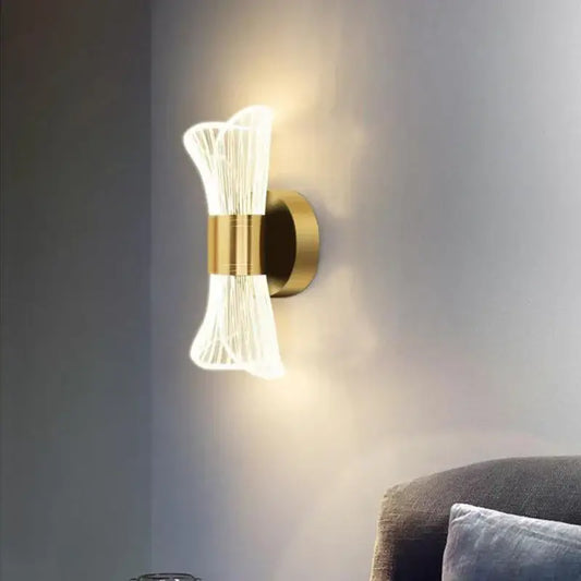 Modern gold crystal wall lamp with sculptural design featuring translucent glass filaments for elegant bedroom decorbites crystal wall lamp