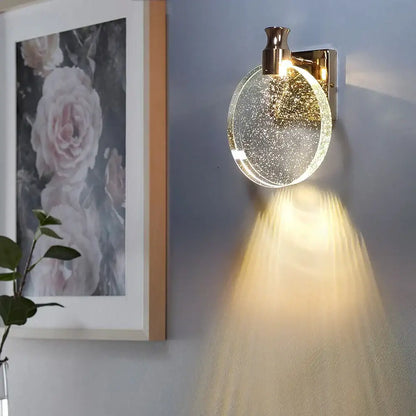 Modern gold crystal wall lamp with clear glass shade and sparkling diffuser for warm bedroom lighting decorbites wall lamp