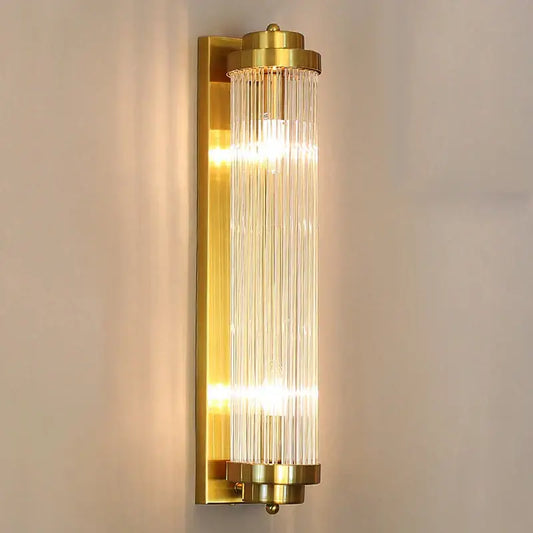 Modern gold crystal wall lamp featuring vertical glass rods, ideal as a decorbites crystal wall lamp for bedrooms