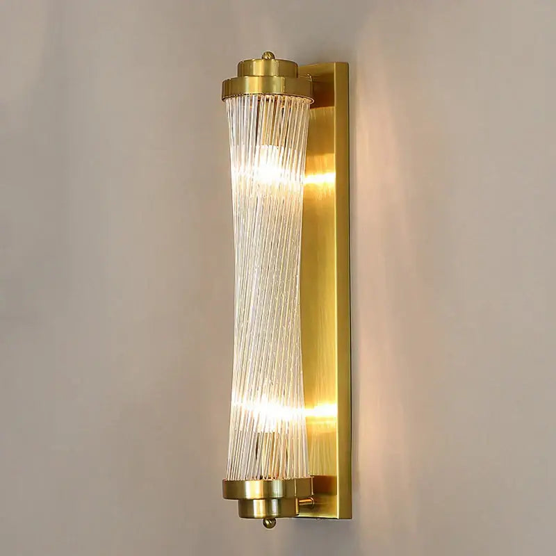 Modern gold crystal wall lamp with cylindrical glass rods and vertical translucent ribbons for warm bedroom lighting decorbites crystal wall lamp