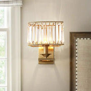Gold-toned modern wall lamp with vertical crystal prisms and rectangular frame for 110v-120v and 220v-240v use