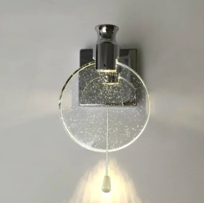 Modern gold crystal wall lamp with chrome finish and clear glass globe featuring decorbites crystal wall elements and pull cord switch