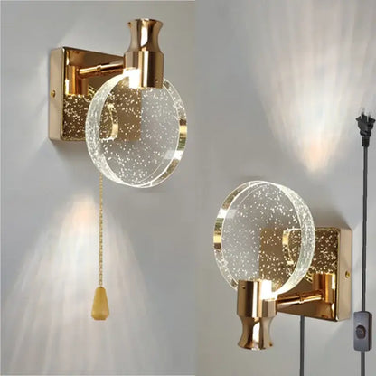 Modern gold crystal wall lamp with clear glass globe filled with sparkling particles for elegant decorbites crystal wall lighting