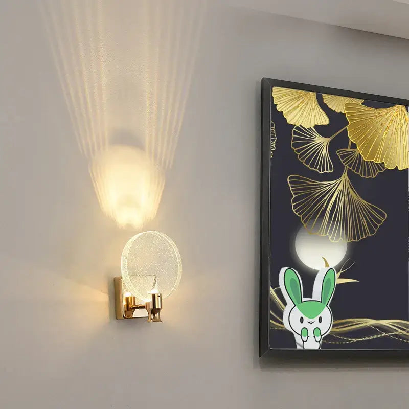 Modern gold crystal wall lamp with circular textured glass globe sconce emitting warm light for living room decorbites crystal wall lamp