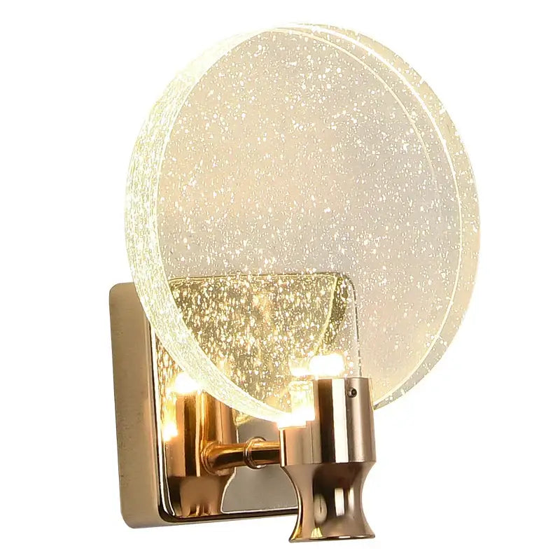 Modern gold crystal wall lamp featuring a gold-toned wall sconce with a frosted glass globe and sparkling particles decorbites crystal wall