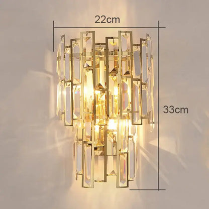 Modern gold crystal wall lamp with cascading rectangular crystal prisms in a tiered design for living room use