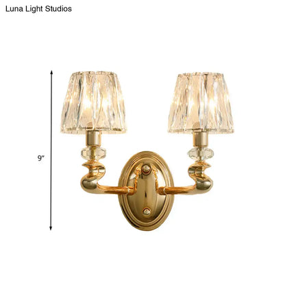 Modern gold wall light fixture with two crystal encrusted lampshades for bedroom lighting