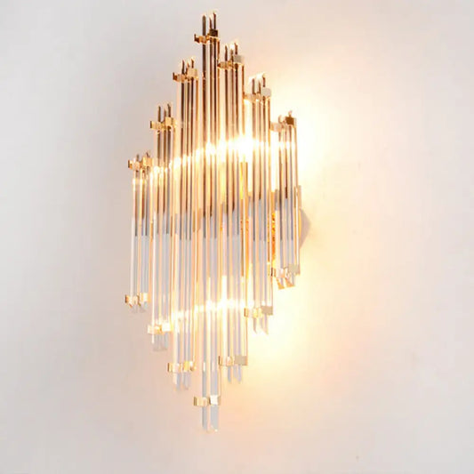 Modern gold wall mounted lamp with clear acrylic rods and brass accents for elegant living room lighting