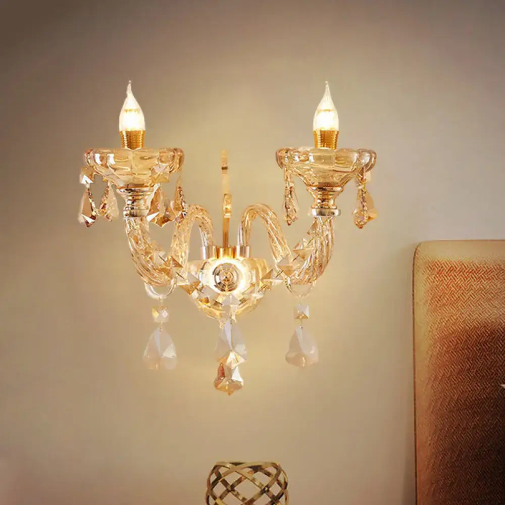Modern gold crystal wall sconce with two candle-style bulbs and faceted glass ornaments inch fixture for bedroom