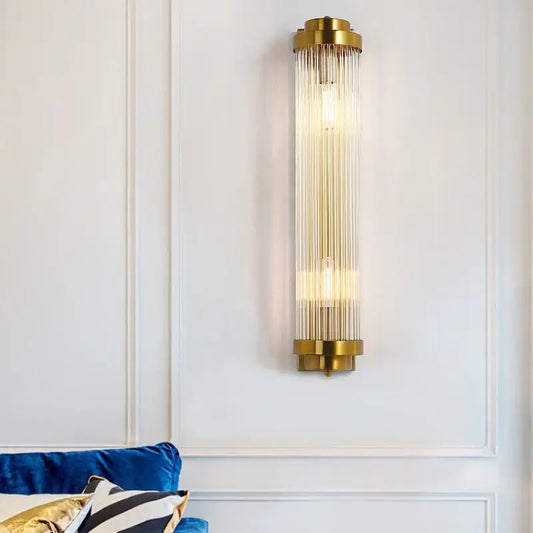 Modern gold crystal wall sconce with vertical glass rods and sleek design for bedroom decorbites crystal wall use