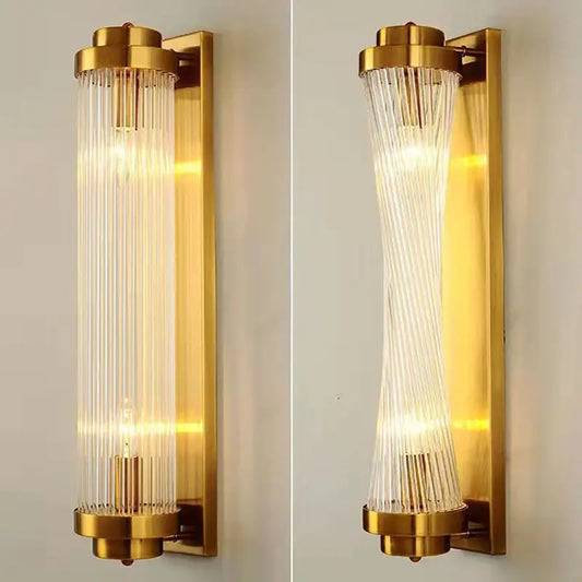 Modern gold crystal wall sconce with vertical glass rods in straight and curved design by decorbites crystal wall lighting