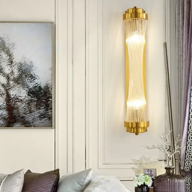 Modern gold crystal wall sconce lamp with cylindrical glass rods emitting warm light for bedroom decorbites crystal wall use