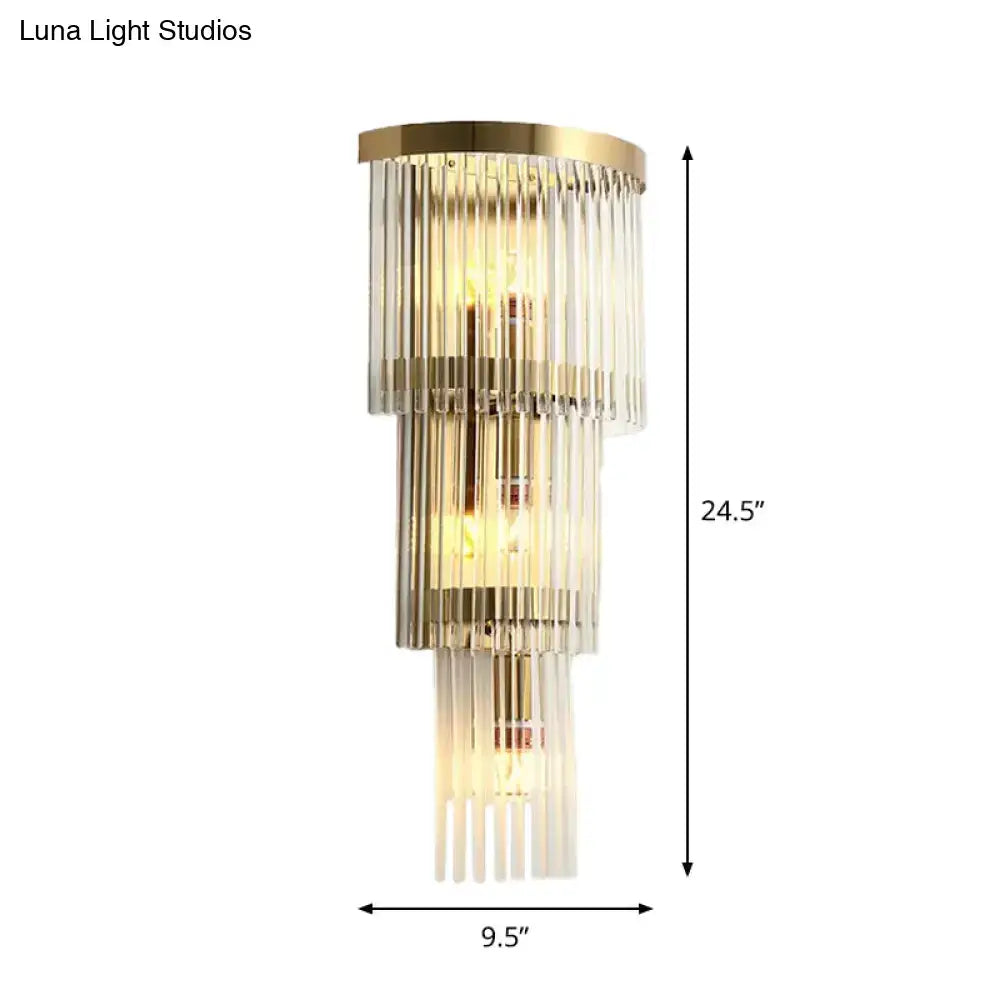 Modern gold crystal wall sconce with gold metal frames and clear glass rods emitting warm glow for living space 110v-120v