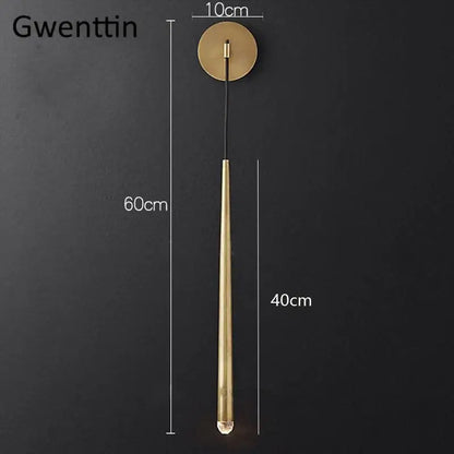 Gwenttin brass wall sconce with sleek cylindrical design and clear bulb for modern gold crystal water drop decorbites crystal water lighting