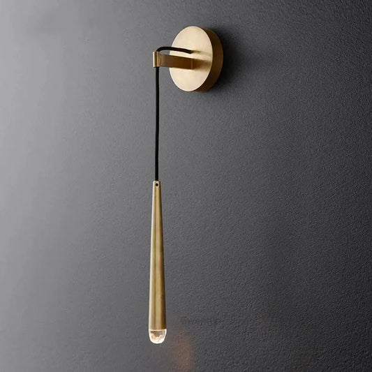 Modern gold crystal water drop wall sconce with sleek teardrop metal body and clear glass bulb for bedroom decor