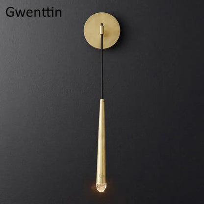 Modern gold crystal water drop wall sconce with brass tapered stem and circular base for bedroom decorbites crystal water lighting