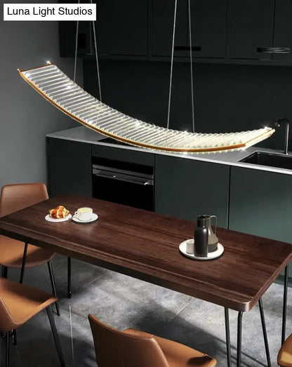 Modern gold curved crystal chandelier featuring a sleek translucent glass panel and warm led illumination for dining room suspended crystal chandelier