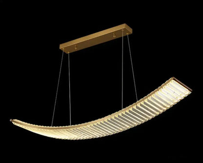 Modern gold-toned suspended crystal chandelier with curved ribbed crystal design for dining room lighting